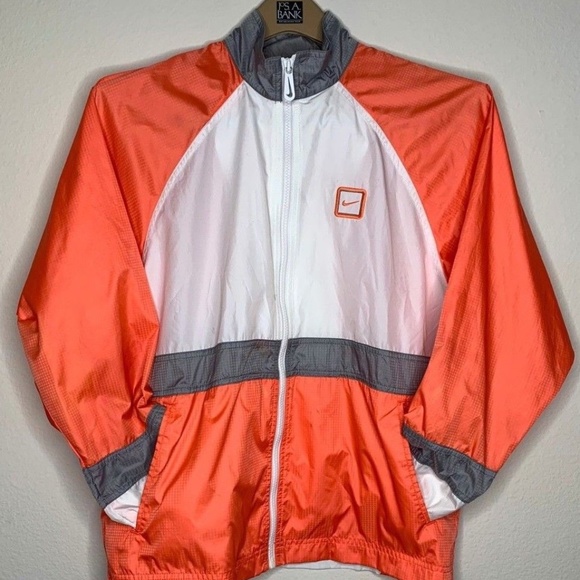 white and orange nike windbreaker